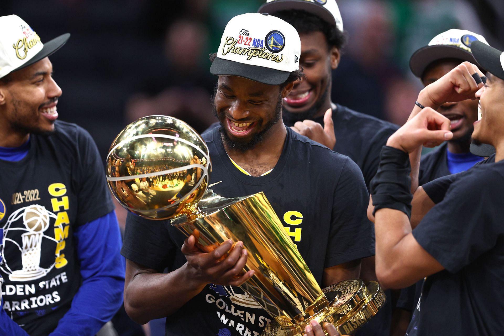 Andrew Wiggins of the Golden State Warriors celebrates with the Larry O&#039;Brien Trophy