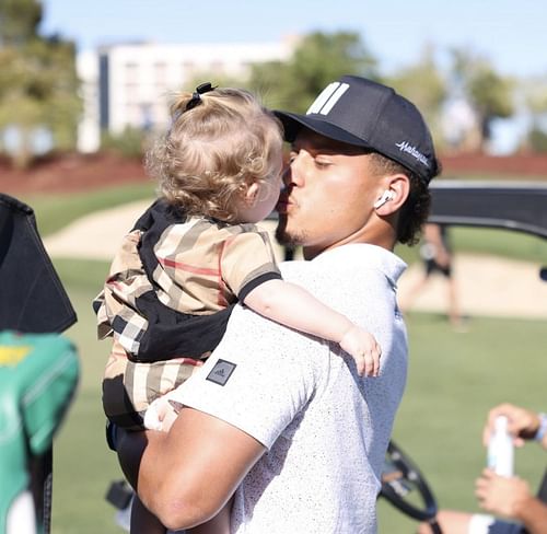 Chiefs QB Patrick Mahomes with daughter Sterling Skye during Capital One's The Match. Source: Ben Walton for Golf Digest