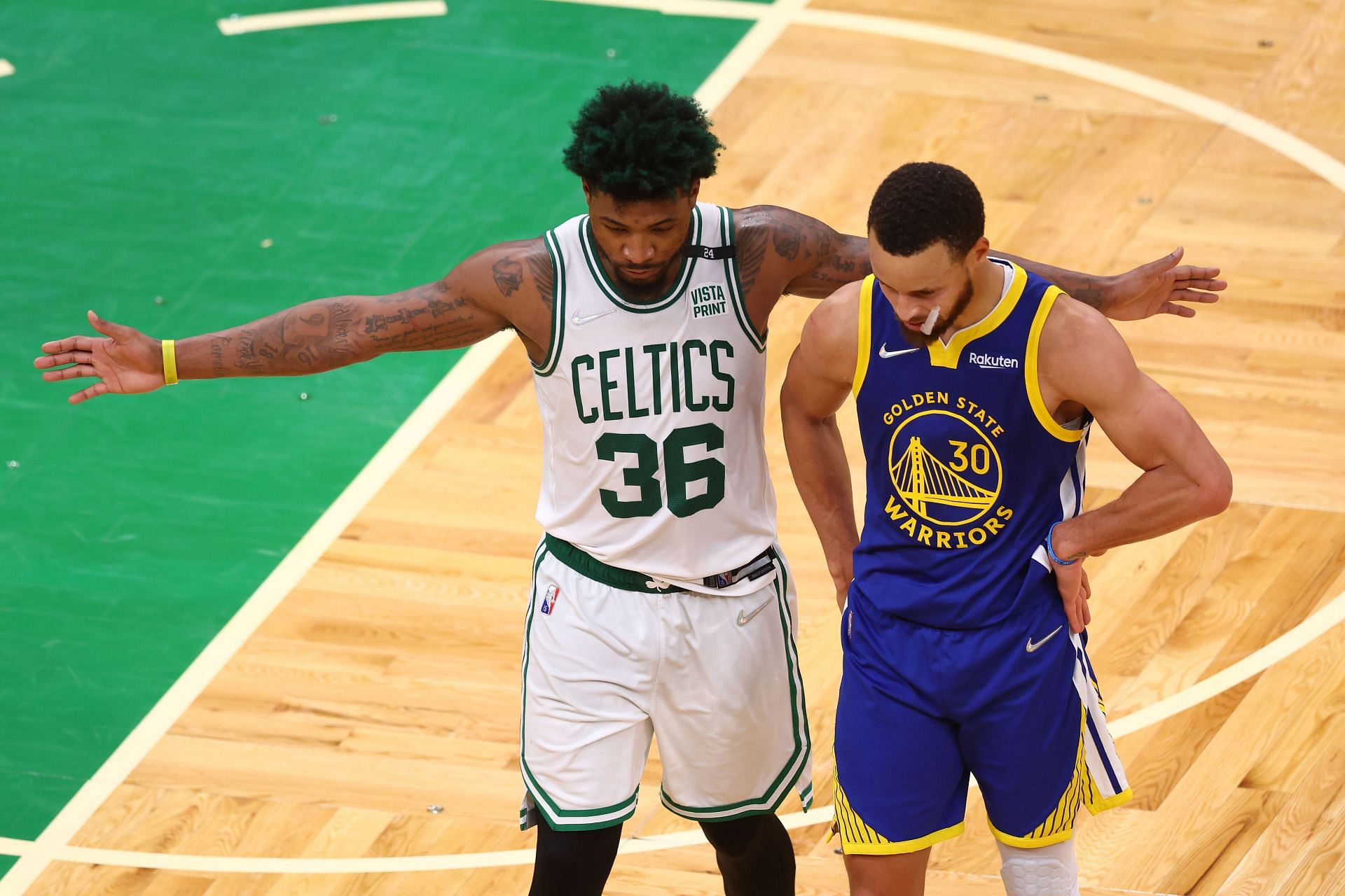 Marcus Smart #36 of the Boston Celtics and Stephen Curry #30 of the Golden State Warriors