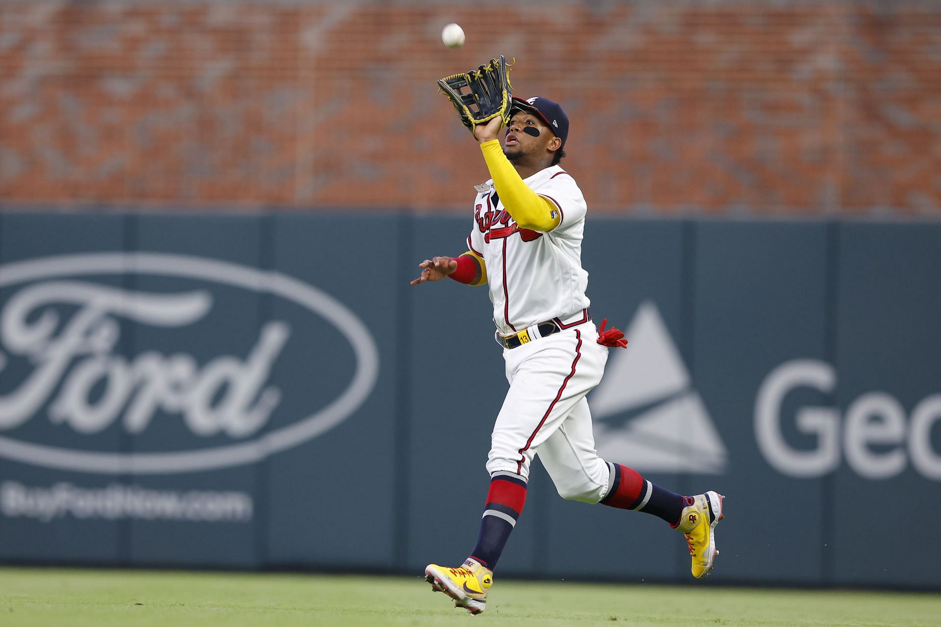 Ronald Acuna Jr. of the Atlanta Braves catches a fly ball against the San Francisco Giants.