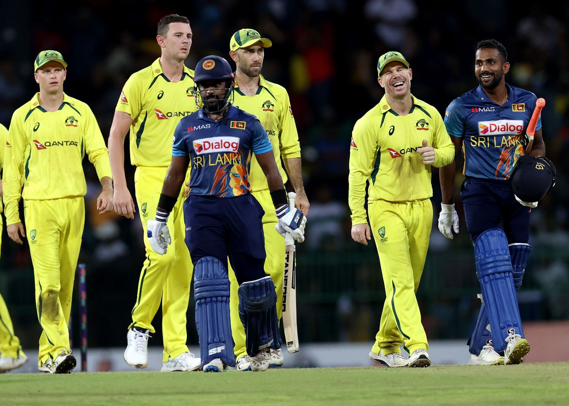 Sri Lankan batsmen walk back after completing a win over Australia in the third ODI