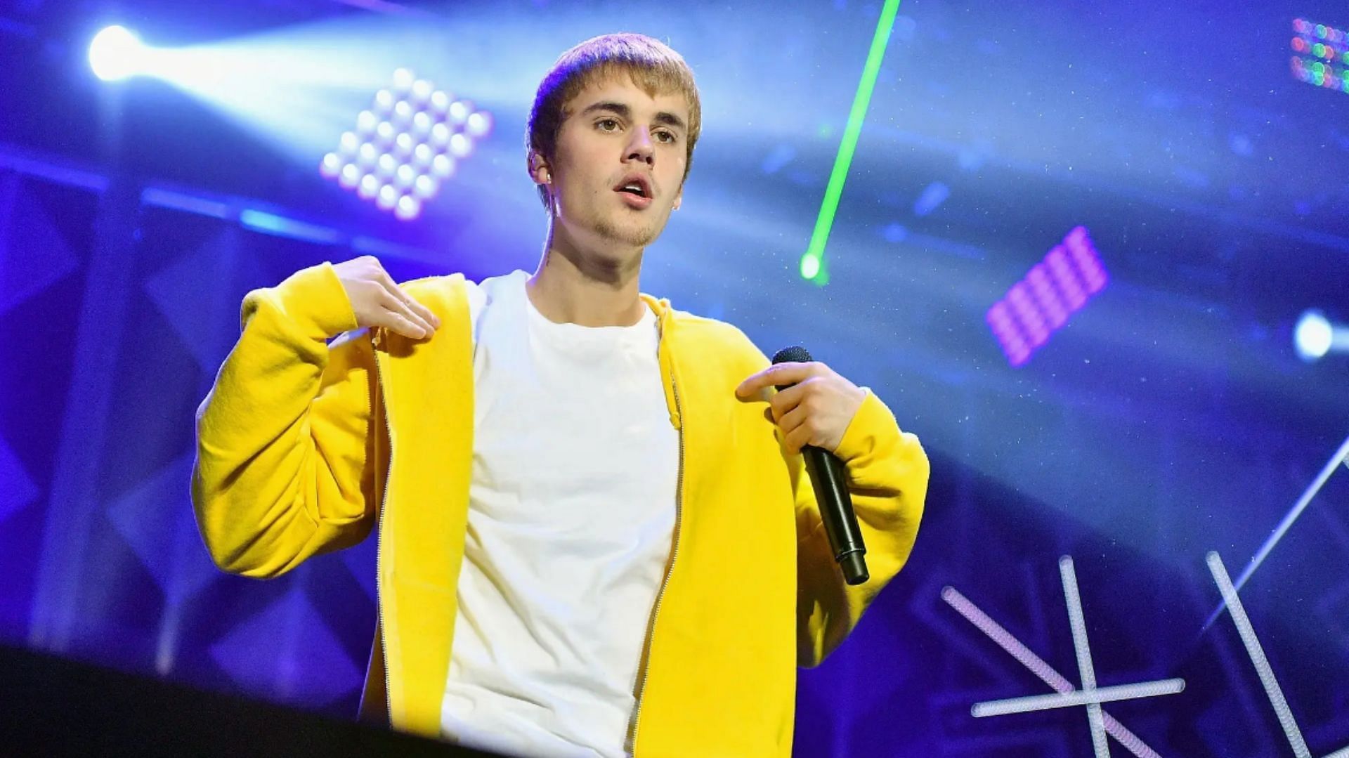 Justin Bieber has postponed his June and early July shows. (Image via Mike Windle / Getty Images)
