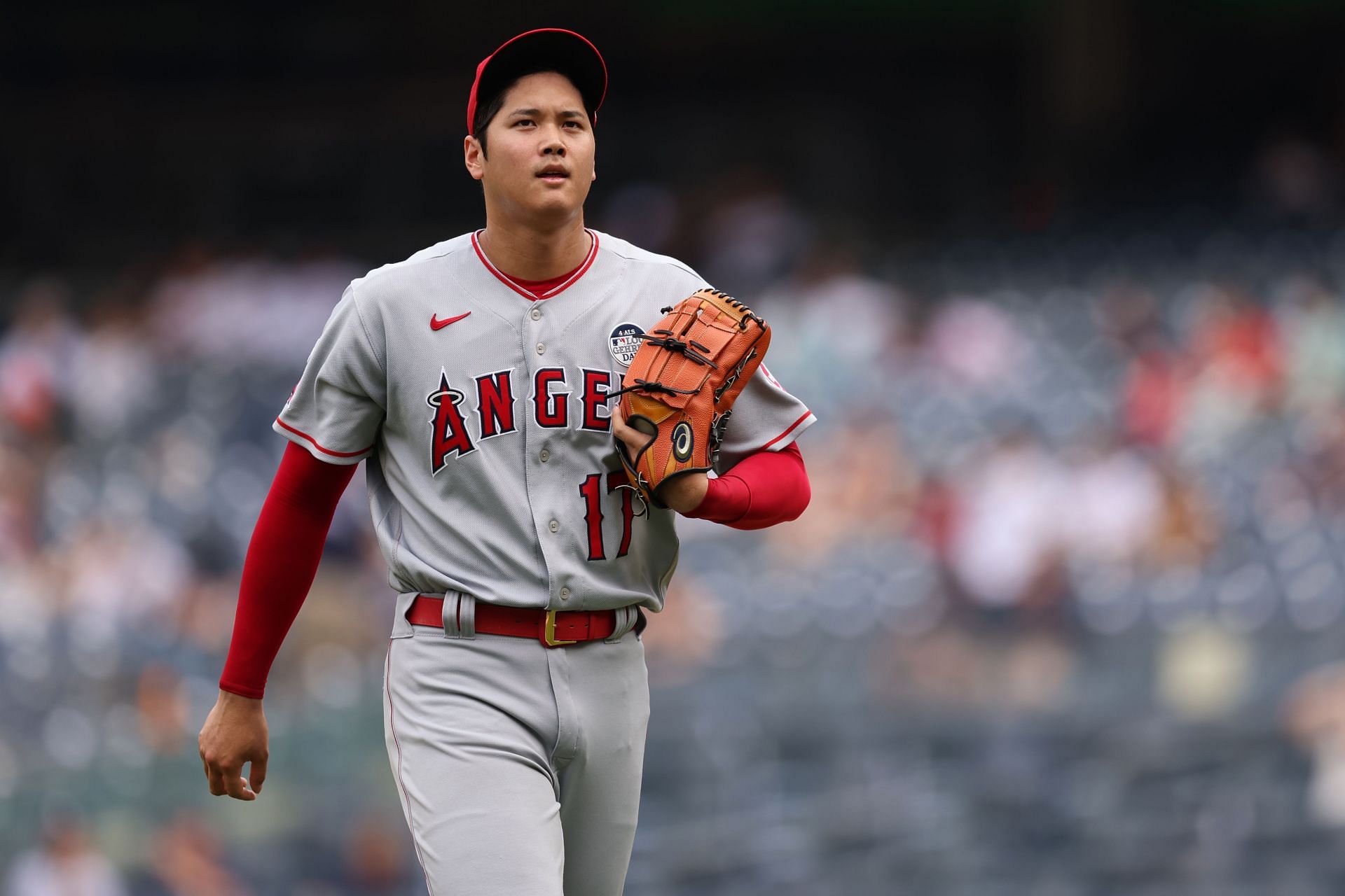 Shohei Ohtani walks back to the dugout in Game 1 of a doubleheader against the New York Yankees.