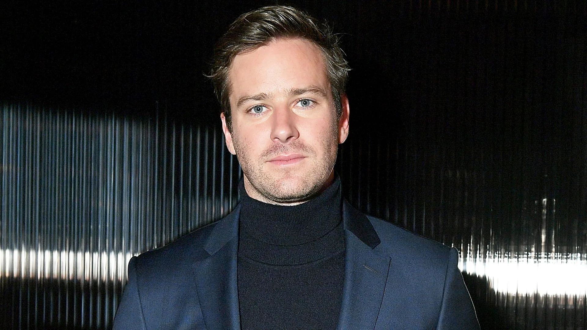 Armie Hammer is reportedly working a cubicle job to support his family. (Image via Mike Coppola/Getty Images)