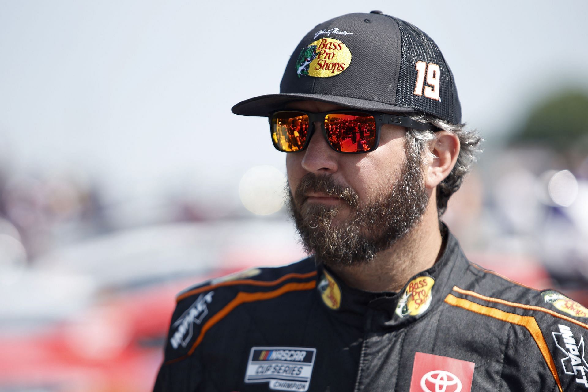 Martin Truex Jr. walks the grid during practice for the NASCAR Cup Series Kwik Trip 250 at Road America