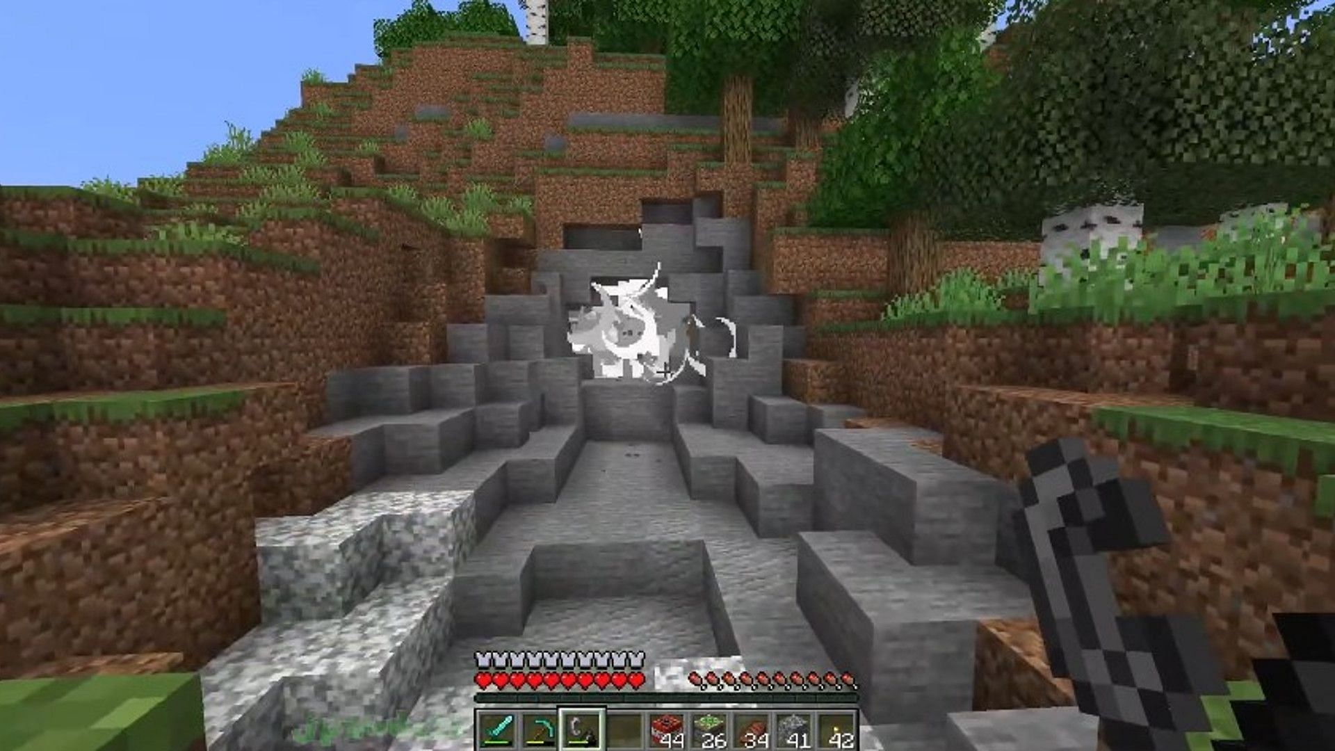 TNT exploding in a cluster of stone (Image via Mojang)