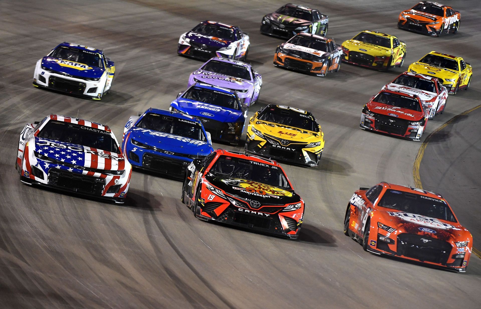 Ross Chastain, Kyle Larson, Martin Truex Jr., and Kevin Harvick race during the NASCAR Cup Series Ally 400 at Nashville Superspeedway