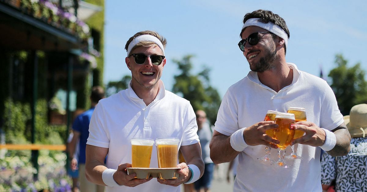 Tennis fans carrying beers at Wimbledon