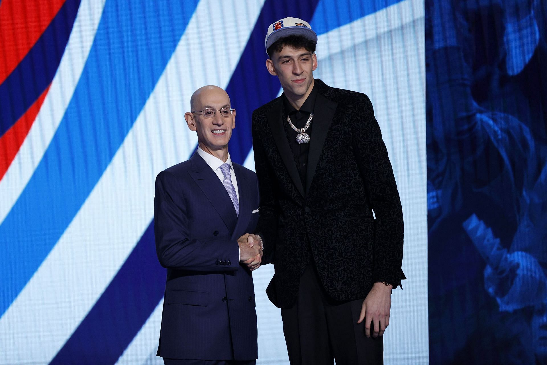 OKC Thunder rookie Chet Holmgren, right, with NBA commissioner Adam Silver at the 2022 draft