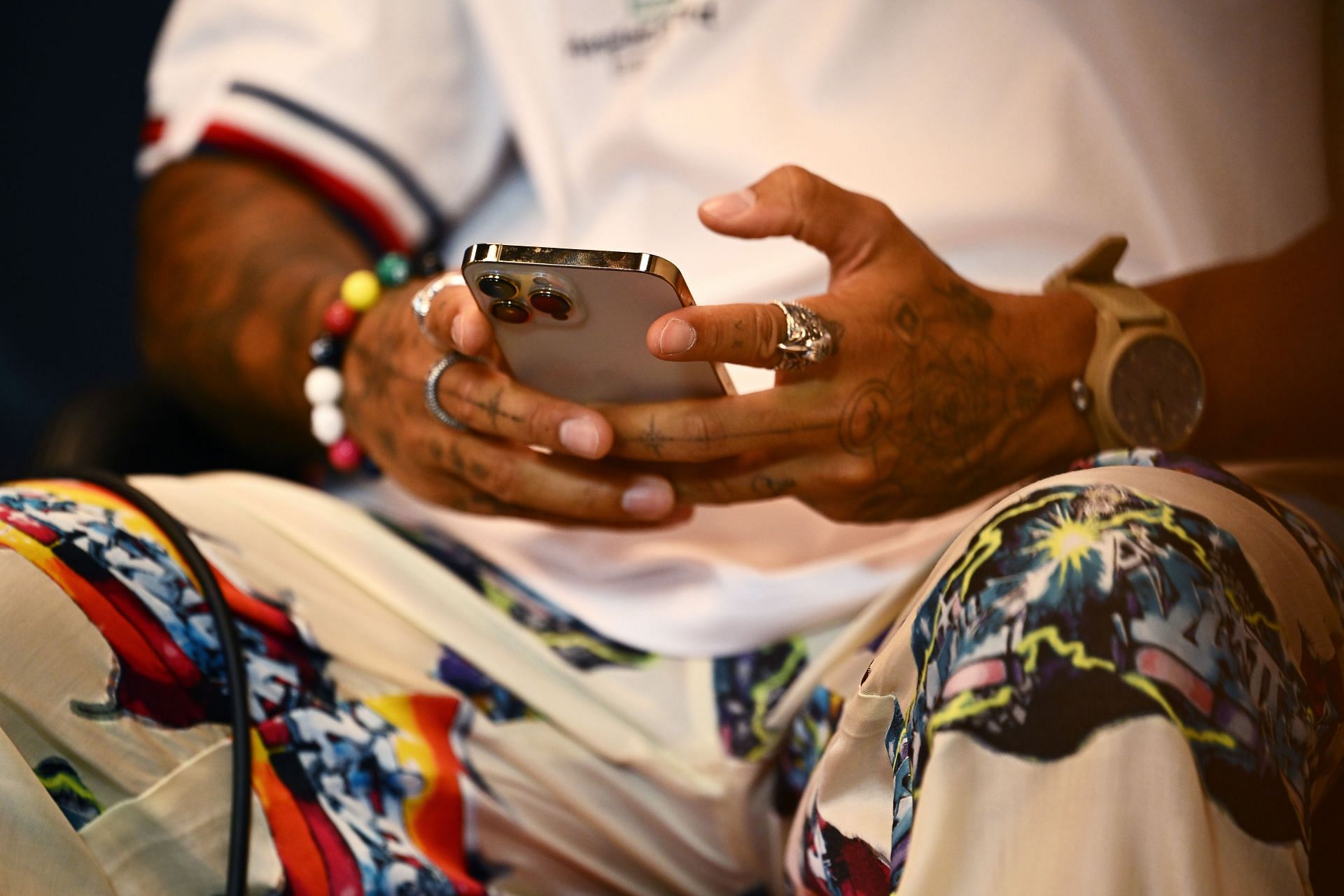 A detailed shot of Lewis Hamilton using his mobile phone in the Drivers&#039; Press Conference before practice ahead of the F1 Grand Prix of Monaco at Circuit de Monaco on May 27, 2022, in Monte-Carlo, Monaco (Photo by Clive Mason/Getty Images)