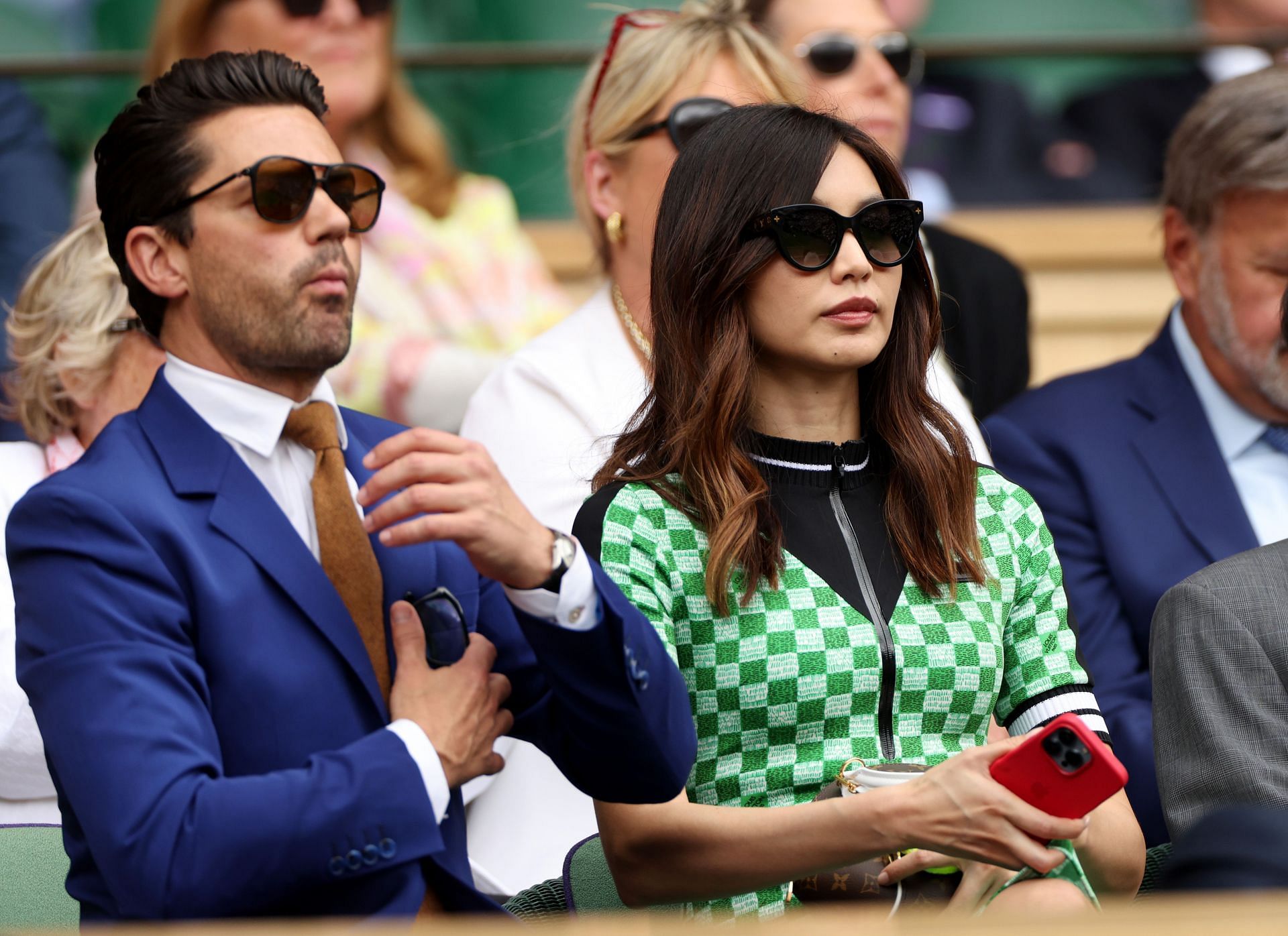 Dominic Cooper and Gemma Chan watching Nadal-Fritz match.
