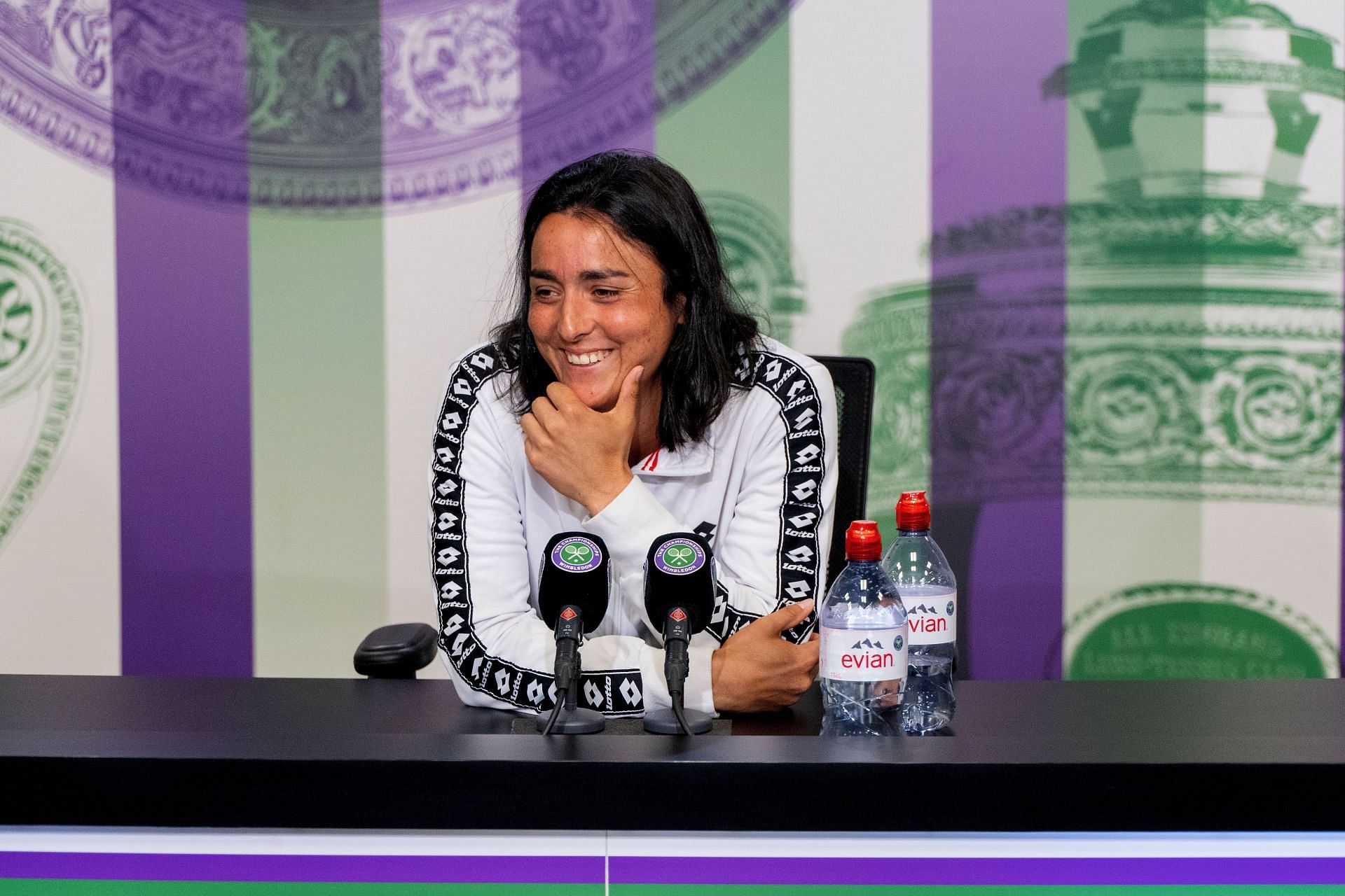 Ons Jabeur smiles during her press conference following her semifinal win at the 2022 Wimbledon Championships