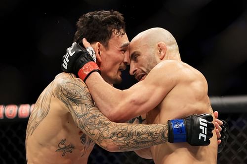 Alexander Volkanovski and Max Holloway embrace each other following their trilogy fight