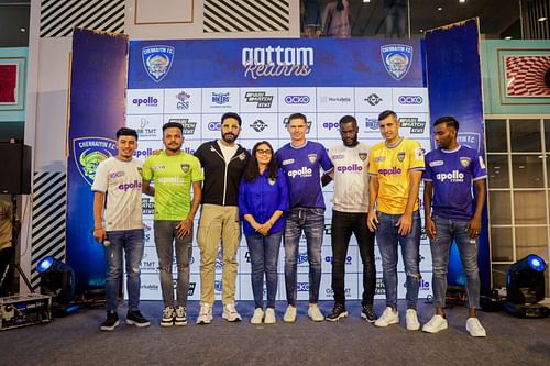 Chennaiyin FC's co-owners, coach and players don their new jersey at their kit reveal. [Credits: CFC]