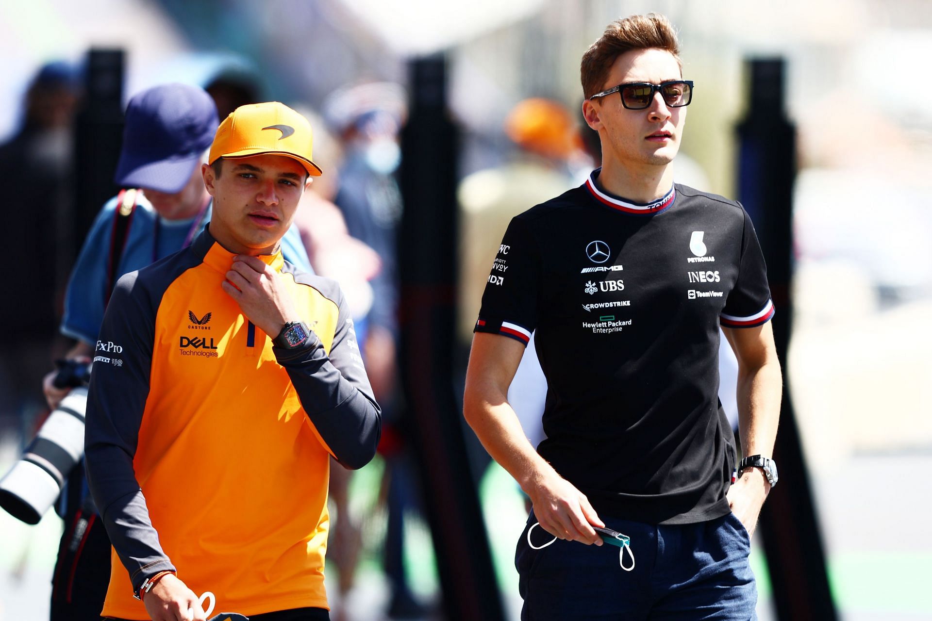 McLaren&#039;s Lando Norris (left) and Mercedes&#039; George Russell walk in the paddock during the 2022 F1 Saudi Arabian GP weekend. (Photo by Mark Thompson/Getty Images)