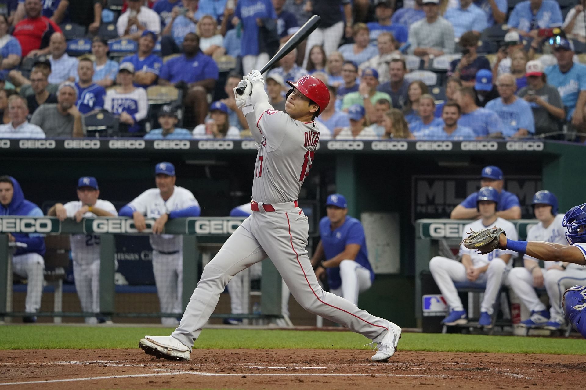 Shohei Ohtani hits a home run in the third inning against the Kansas City Royals at Kauffman Stadium.