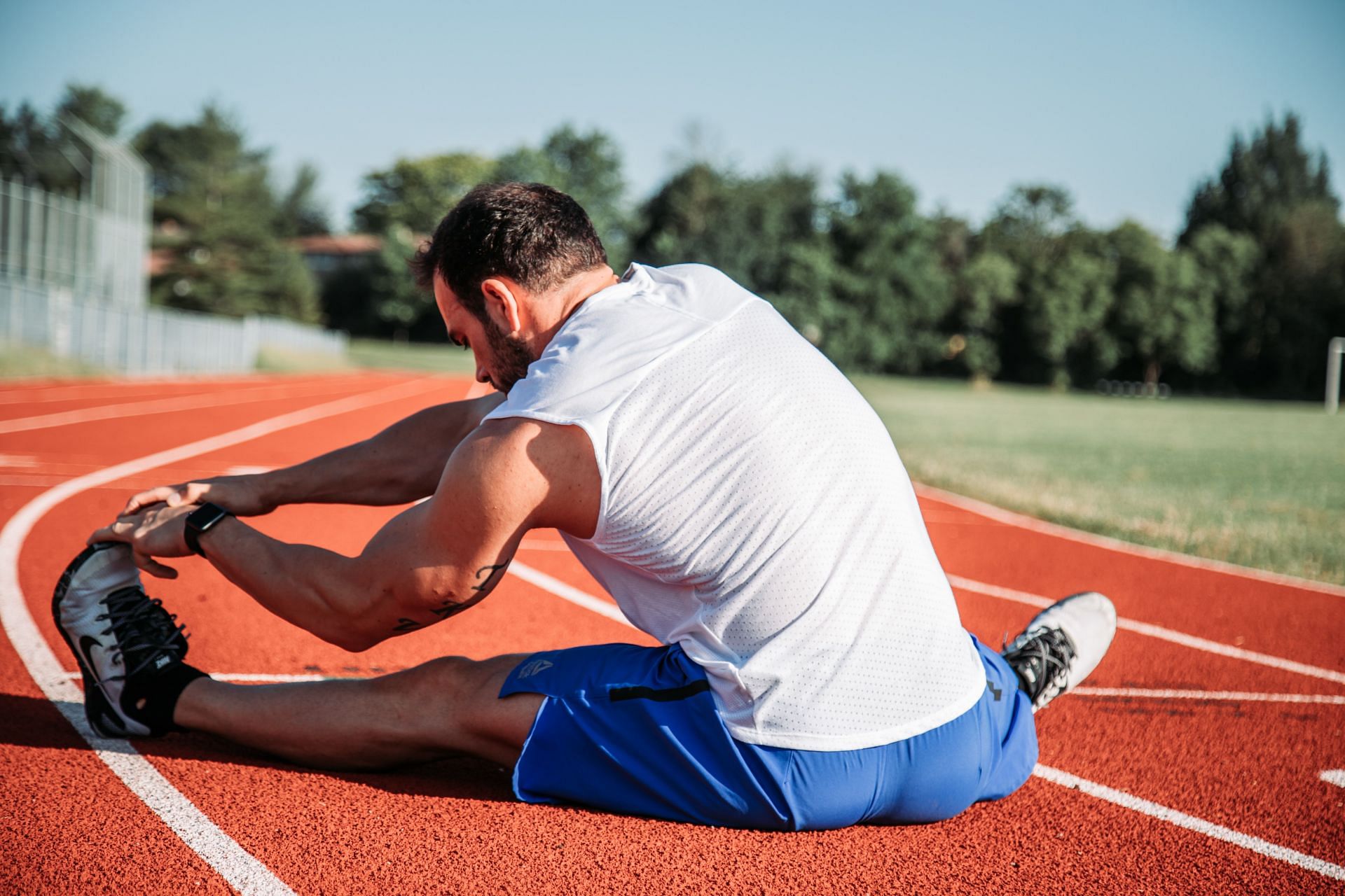 Stretching can help hamstrings release their stiffness. (Image via Unsplash/Alora Griffiths)