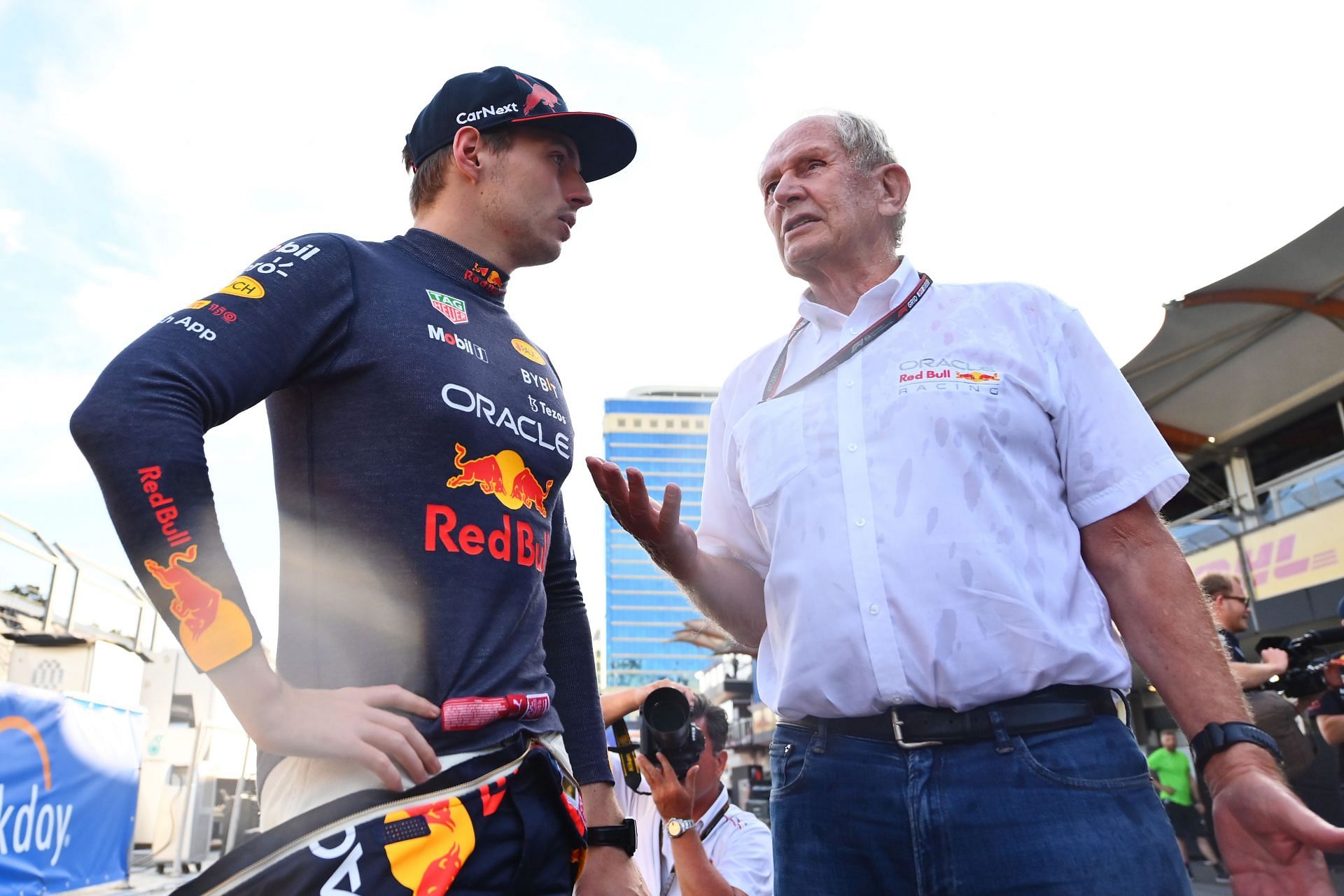 Red Bull driver Max Verstappen and team advisor Dr. Helmut Marko share a moment during the 2022 F1 Azerbaijan GP. (Photo by Dan Mullan/Getty Images)