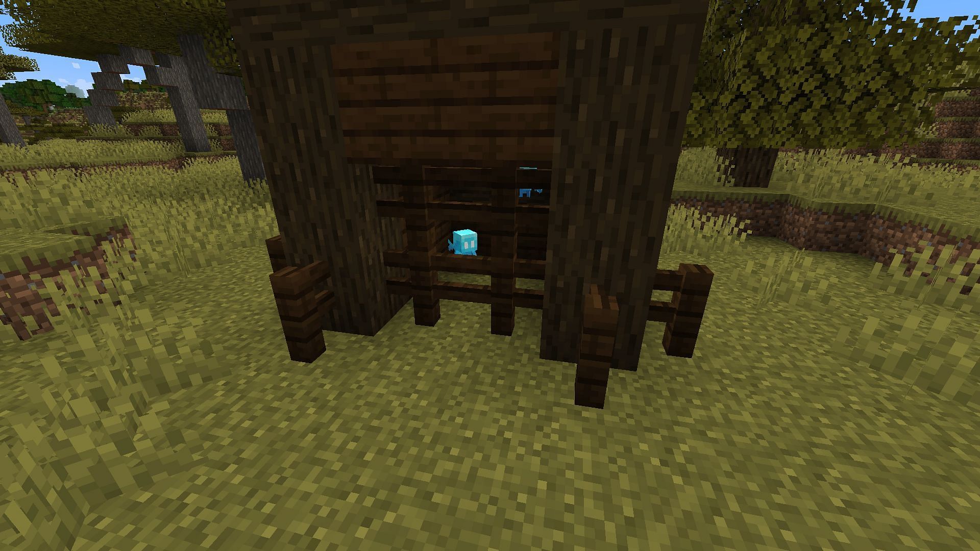 An Allay in a dark oak cage &mdash; the mob with the only substantial change in 1.19.1 (Image via Minecraft)