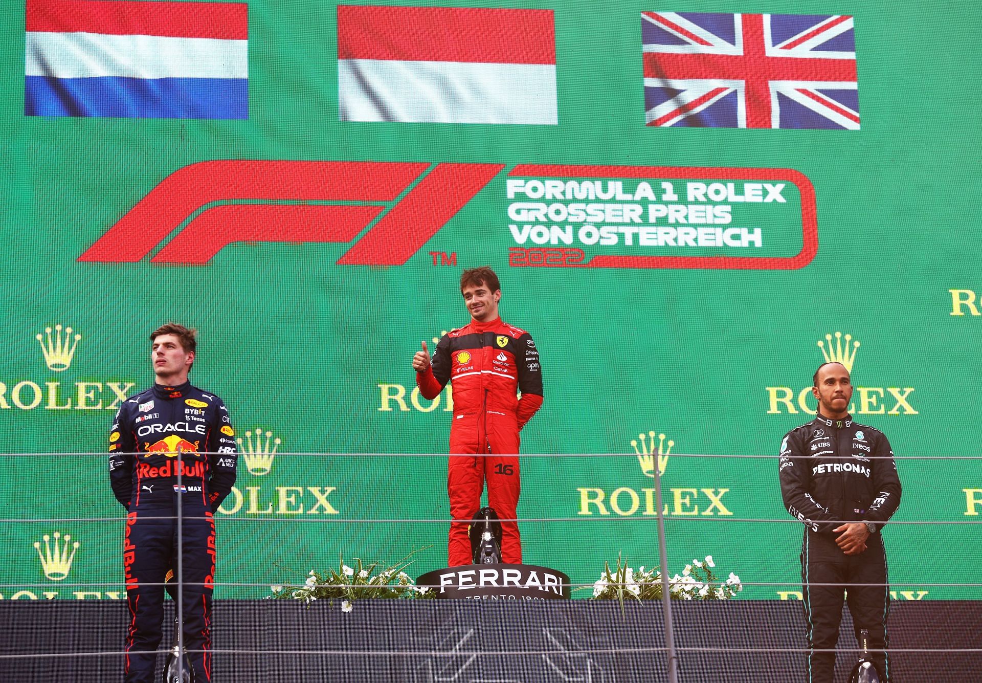 (From L to R) Red Bull&#039;s Max Verstappen, Ferrari&#039;s Charles Leclerc, and Mercedes&#039; Lewis Hamilton on the podium at the 2022 F1 Austrian GP (Photo by Clive Rose/Getty Images)