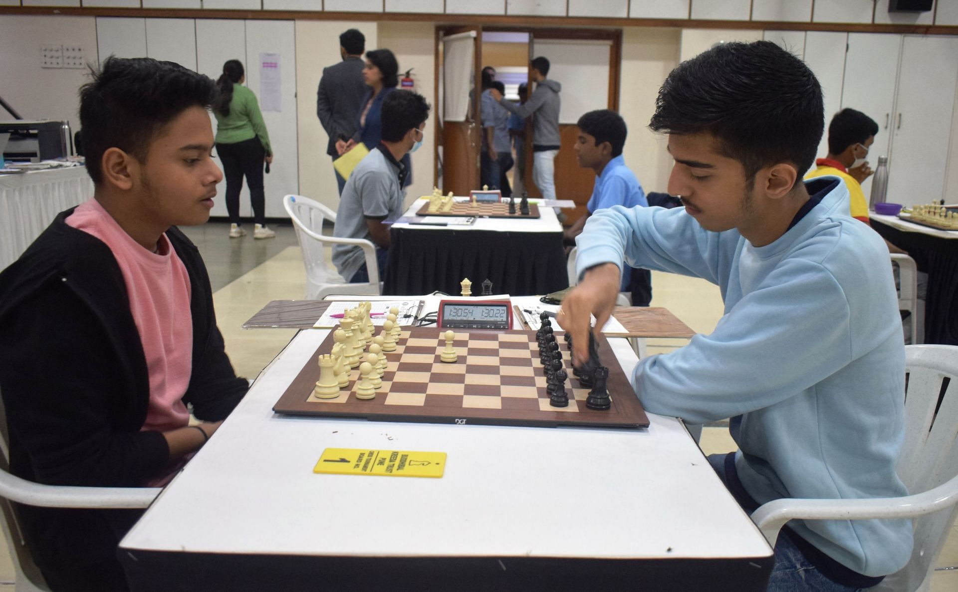 Rishabh Gokhale (R) makes a move against Vrashank Chouhan in the fifth round in Pune on Friday. (Pic credit: AICF)