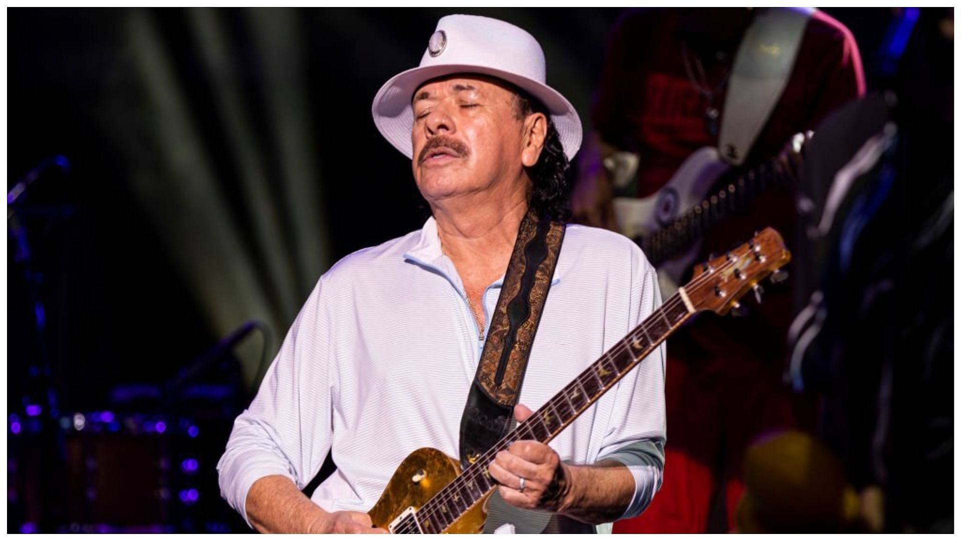 Carlos Santana passed out while performing on stage at an event in Michigan (Image via Scott Legato/Getty Images)