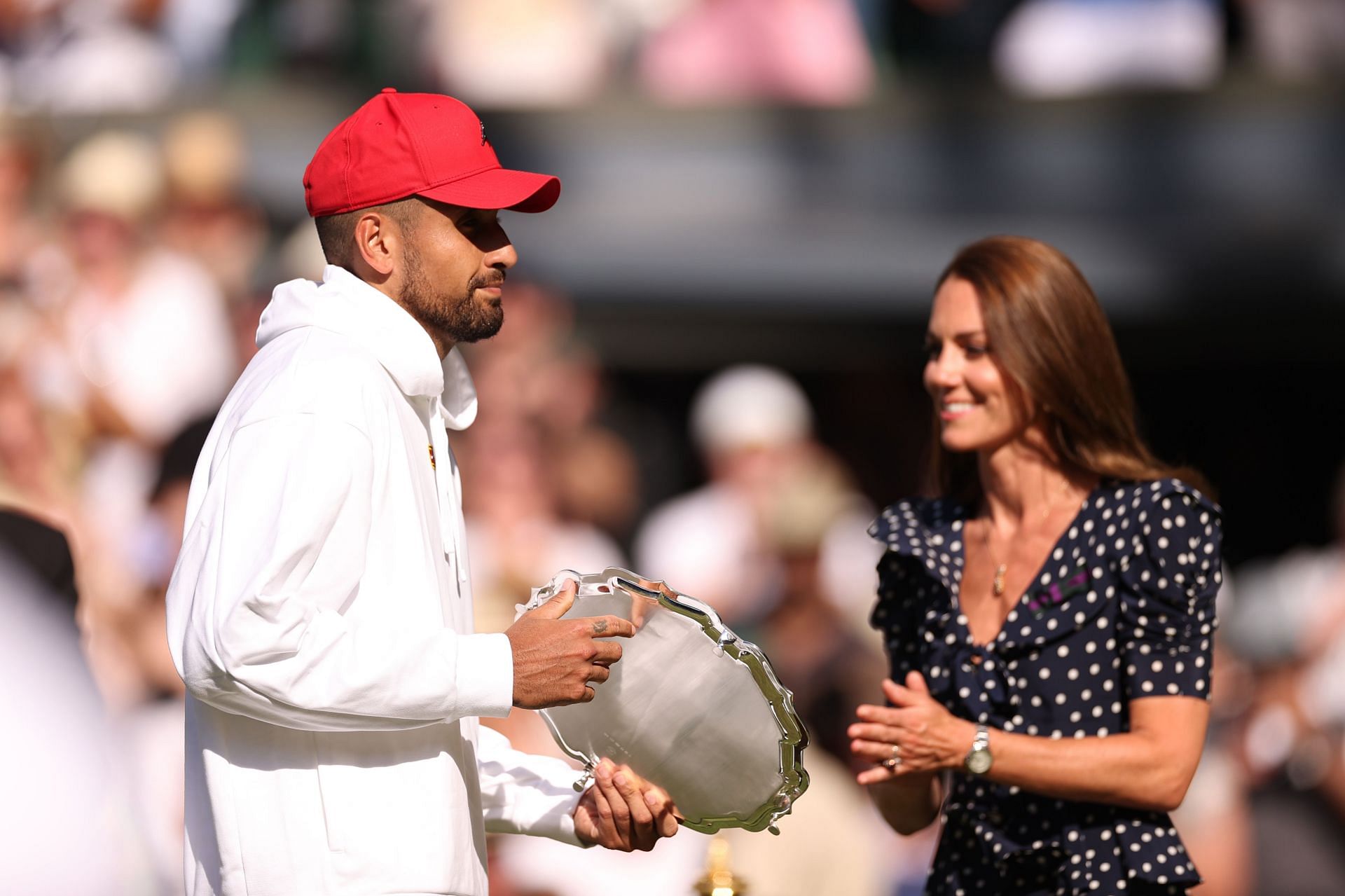 Nick Kyrgios collects his runner-up trophy