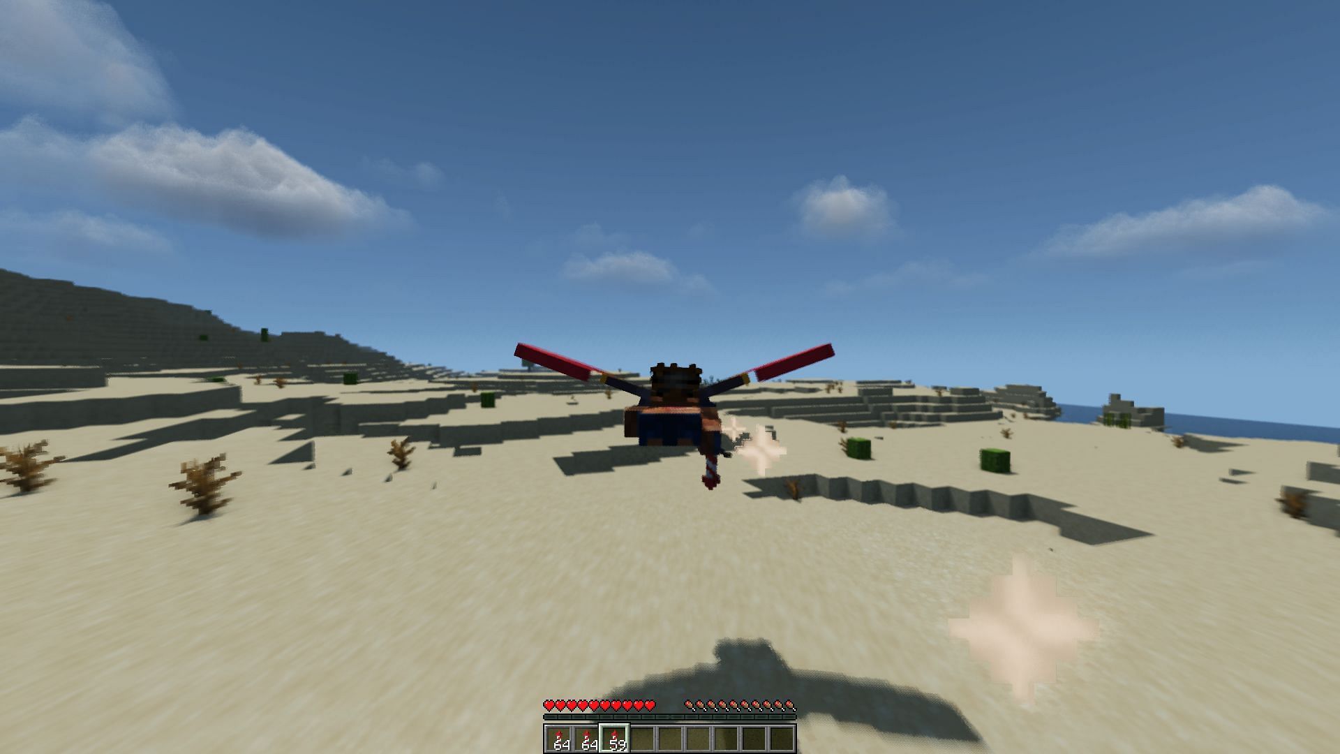 A player flying with an elytra through a desert (Image via Minecraft)