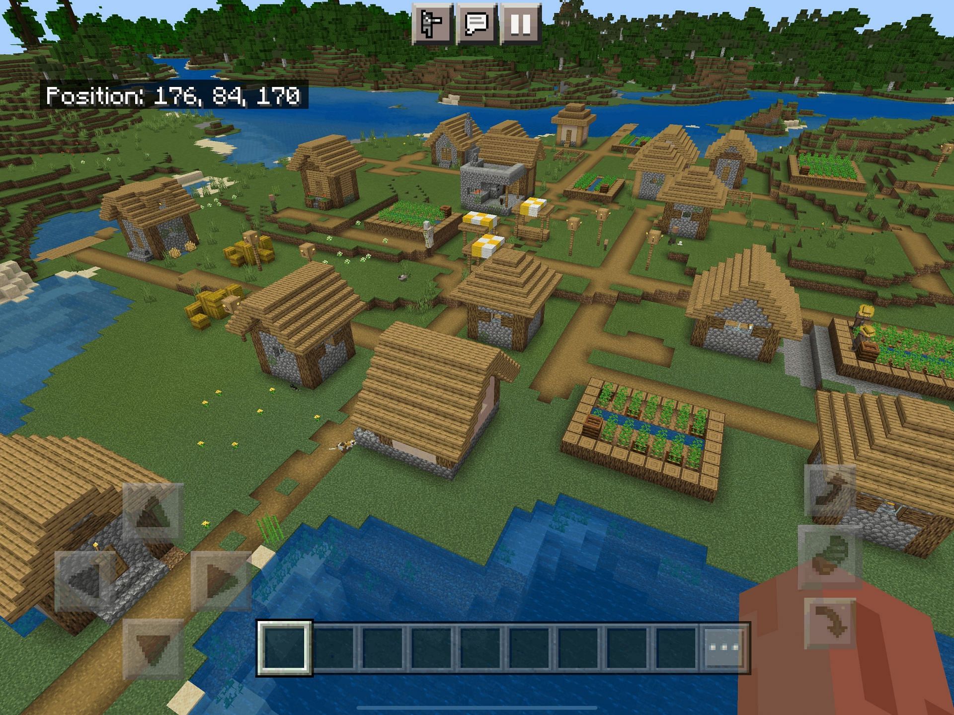 The large village that players spawn in featuring the ruined portal (Image via Mojang, Minecraft)