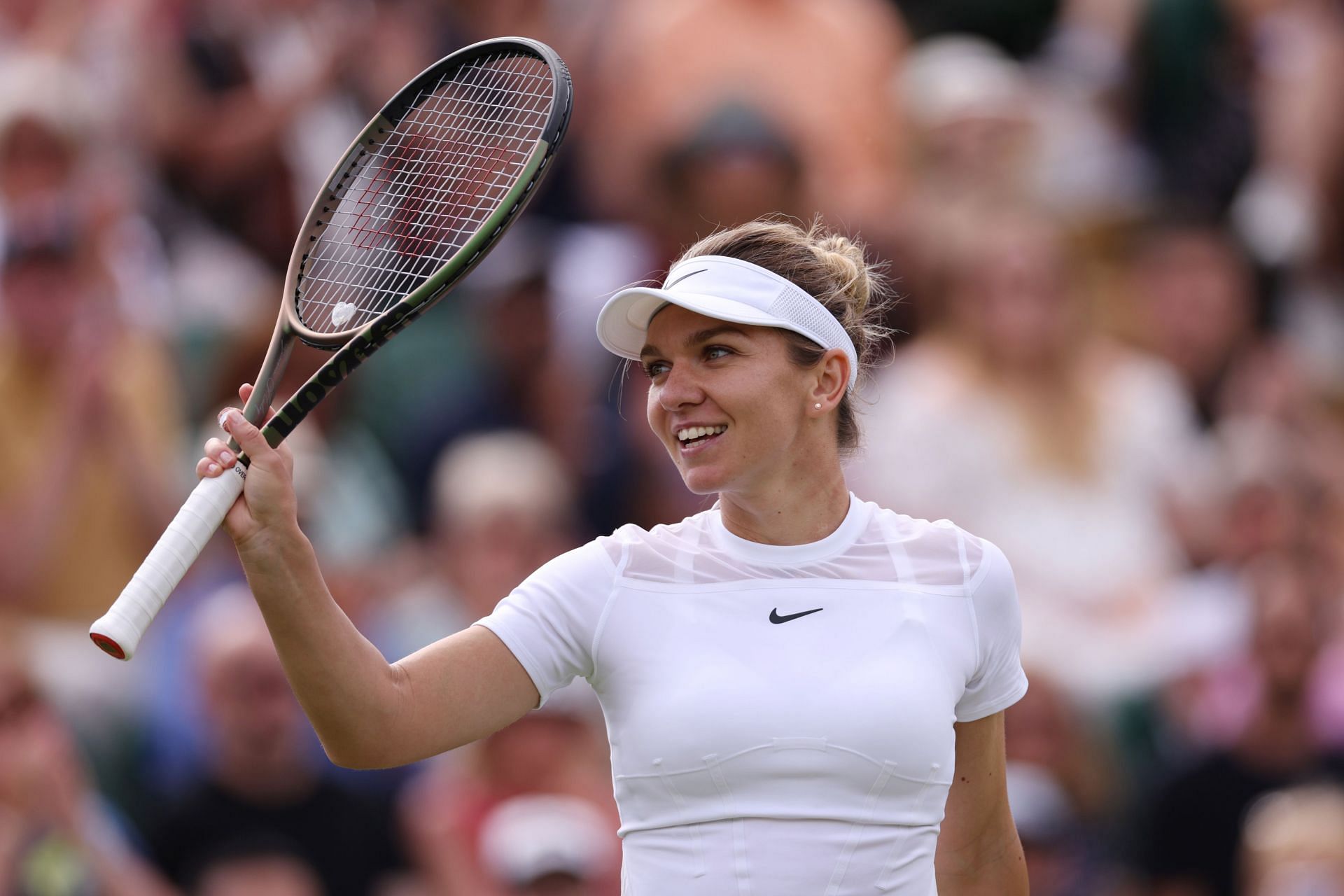 Halep acknowledges the crowd after her third-round win at the 2022 Wimbledon Championships