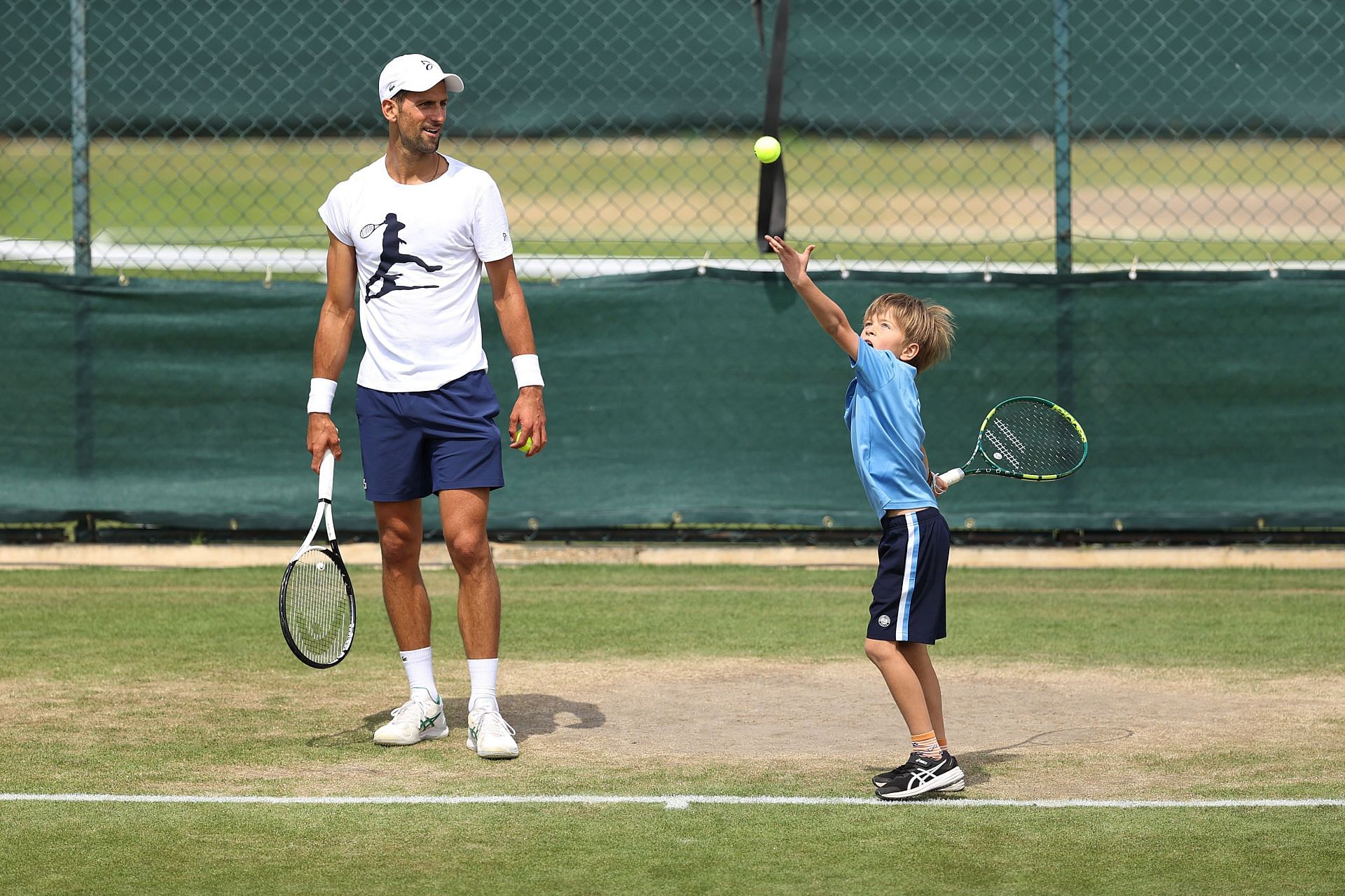 Novak Djokovic practices with his son Stefan at Wimbledon 2022