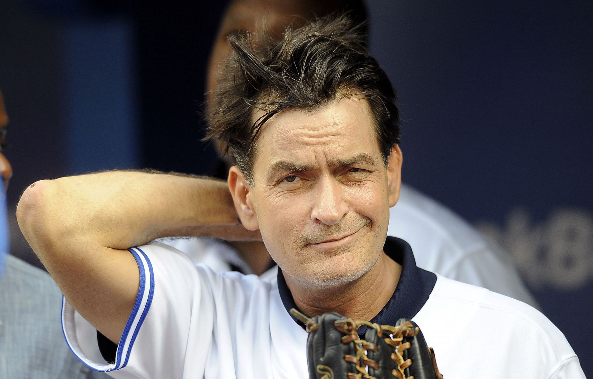 Actor Charlie Sheen threw out the ceremonial first pitch prior to a game between the Toronto Blue Jays and Chicago White Sox August 14, 2012, at Rogers Centre.