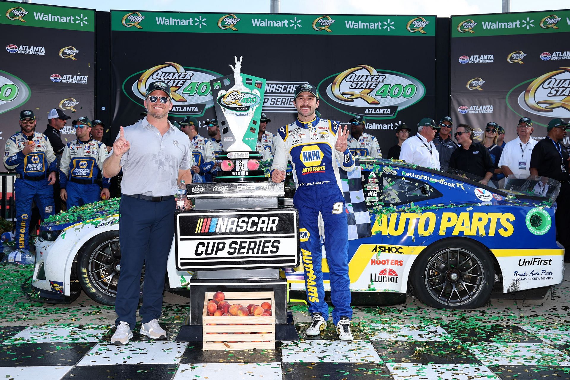 Chase Elliott poses with Marcus Smith, President and CEO, Speedway Motorsports in victory lane after winning the NASCAR Cup Series Quaker State 400 at Atlanta Motor Speedway (Photo by James Gilbert/Getty Images)