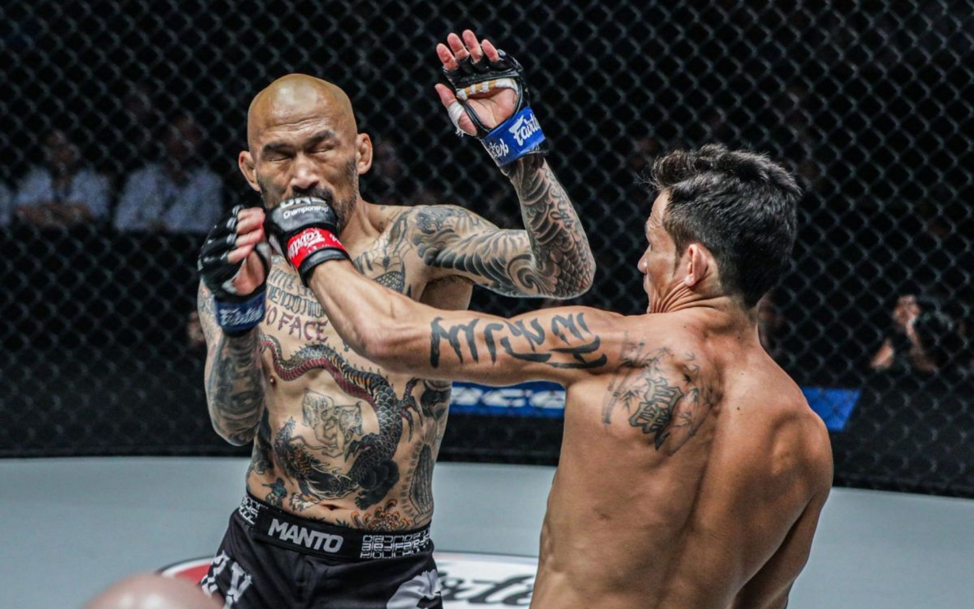 Le lands a left hook to the face of Kotetsu Boku. [Photo ONE Championship]