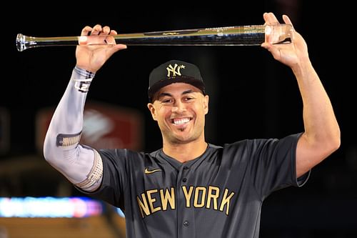 Giancarlo Stanton proudly displays the MVP trophy for the 92nd MLB All-Star Game presented by Mastercard.