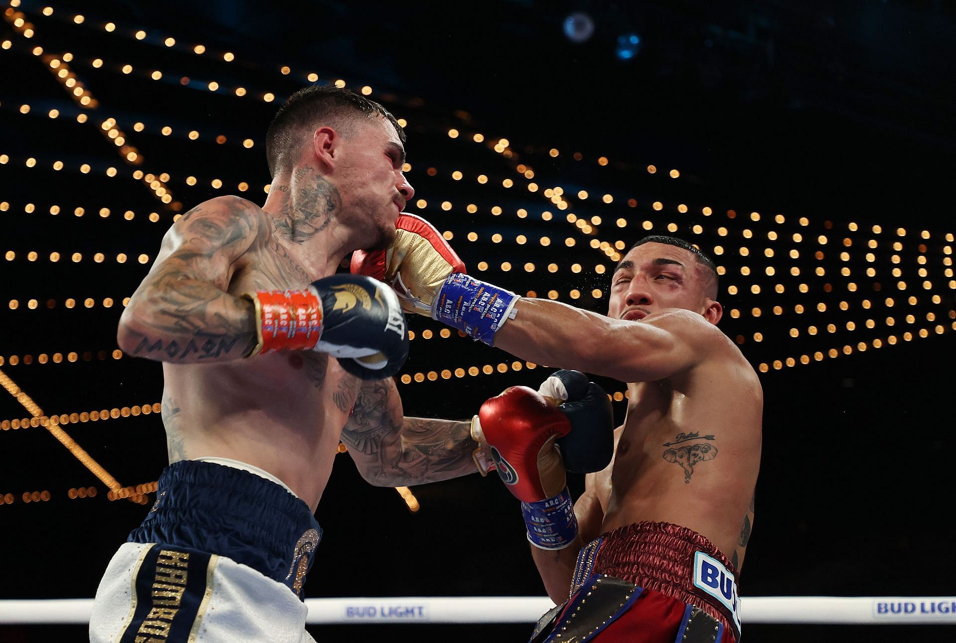 George Kambosos (L) fighting Teofimo Lopez (R)