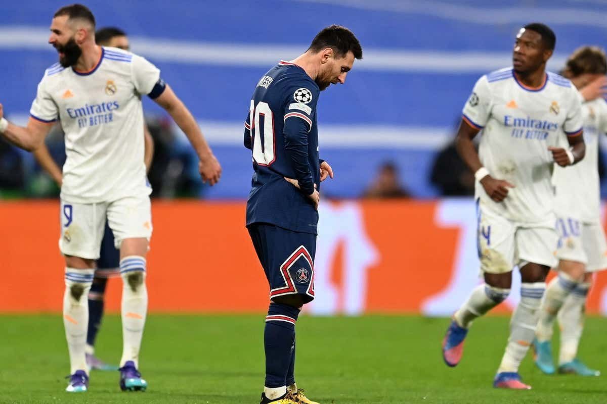 Real Madrid players celebrate their victory as Lionel Messi despairs