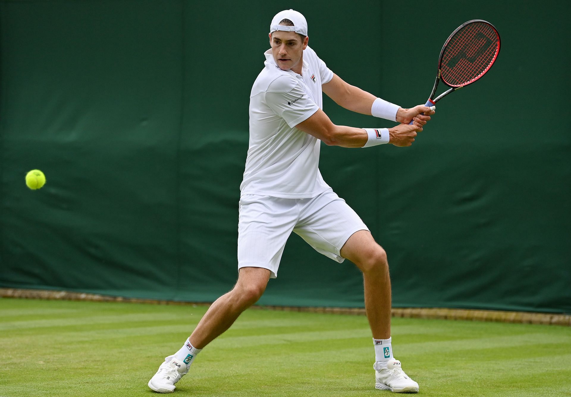 John Isner in action at Wimbledon
