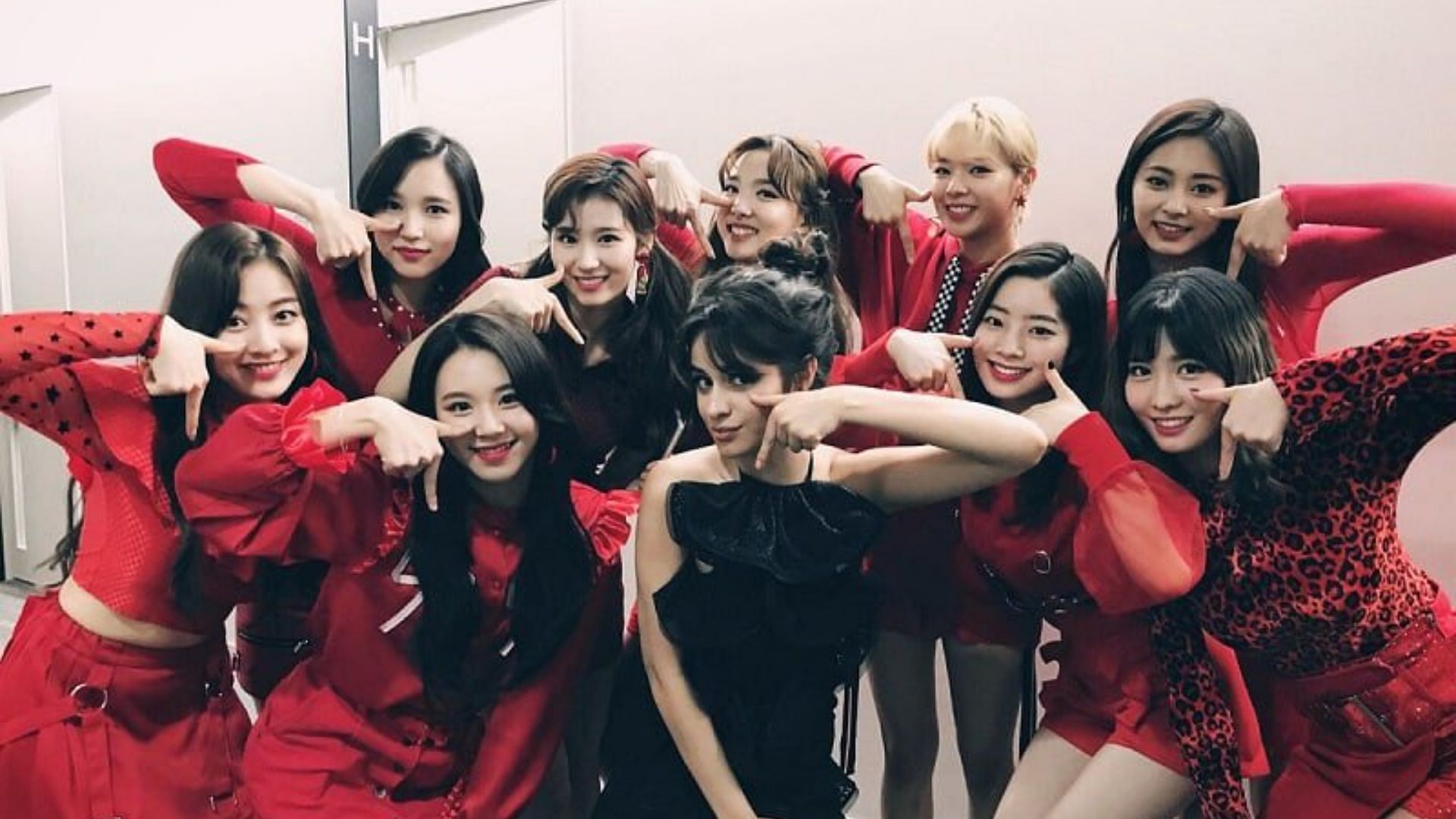 TWICE doing the TT pose with Camila Cabello (Image via @WORLDMUSICAWARD/Twitter)