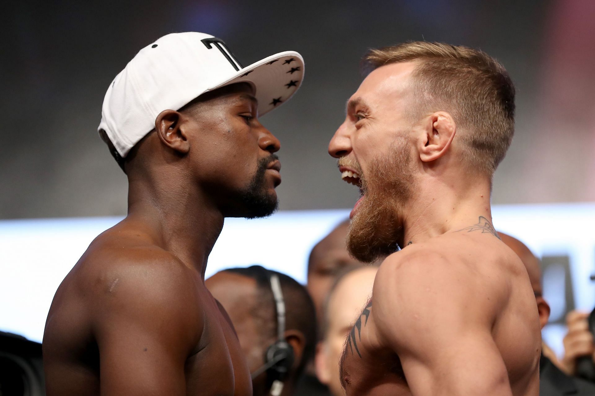 Floyd Mayweather (L), and Conor McGregor (R).
