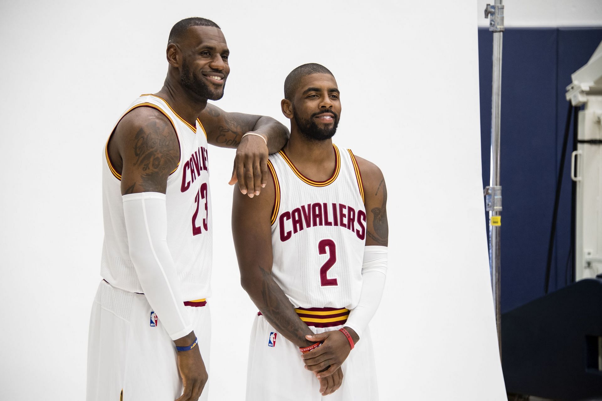 LeBron James, left, and Kyrie Irving pose together.