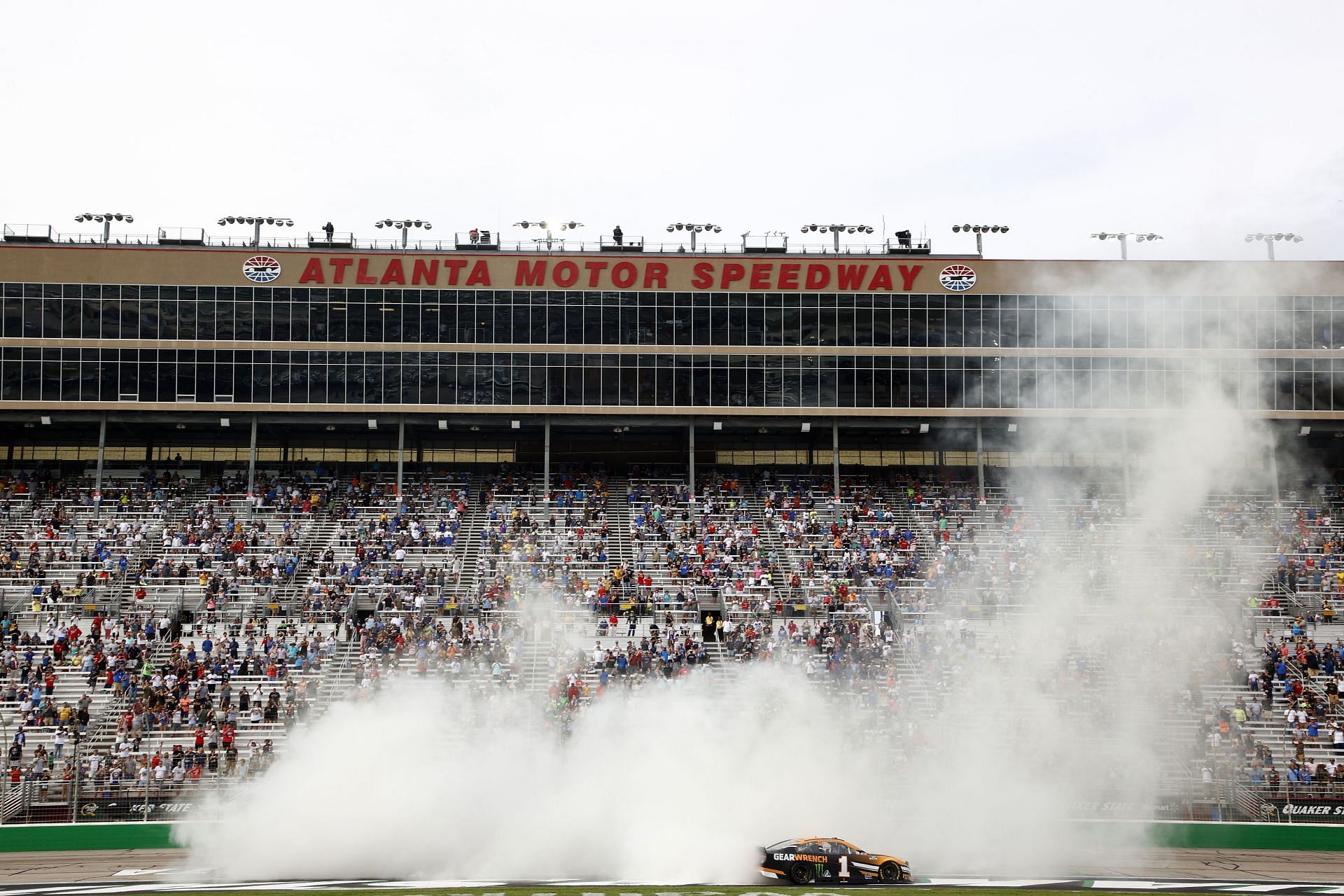 Kurt Busch celebrates with a burnout after winning the NASCAR Cup Series Quaker State 400 presented by Walmart at Atlanta Motor Speedway (Photo by Jared C. Tilton/Getty Images)