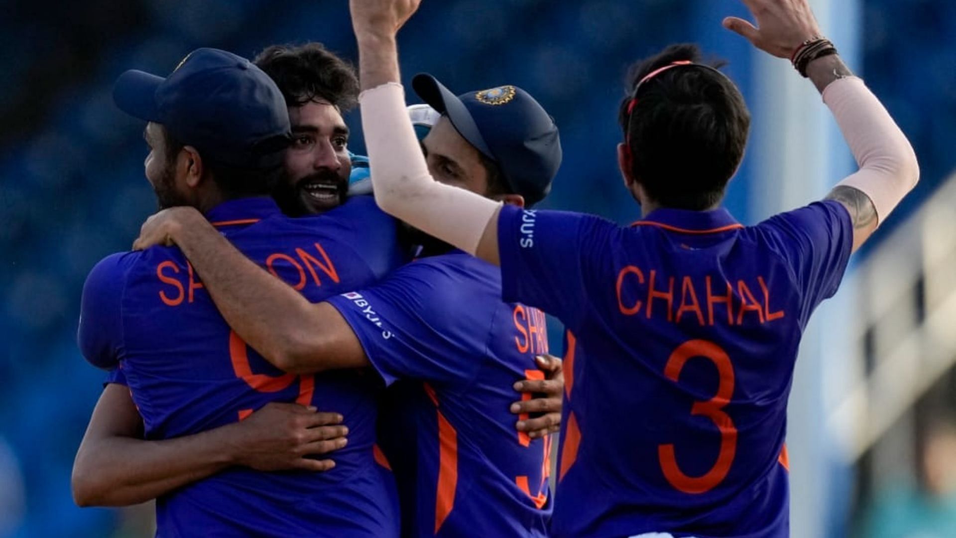 Yuzvendra Chahal and other teammates swarm around Siraj after India win by three runs. (P.C.:Fancode)