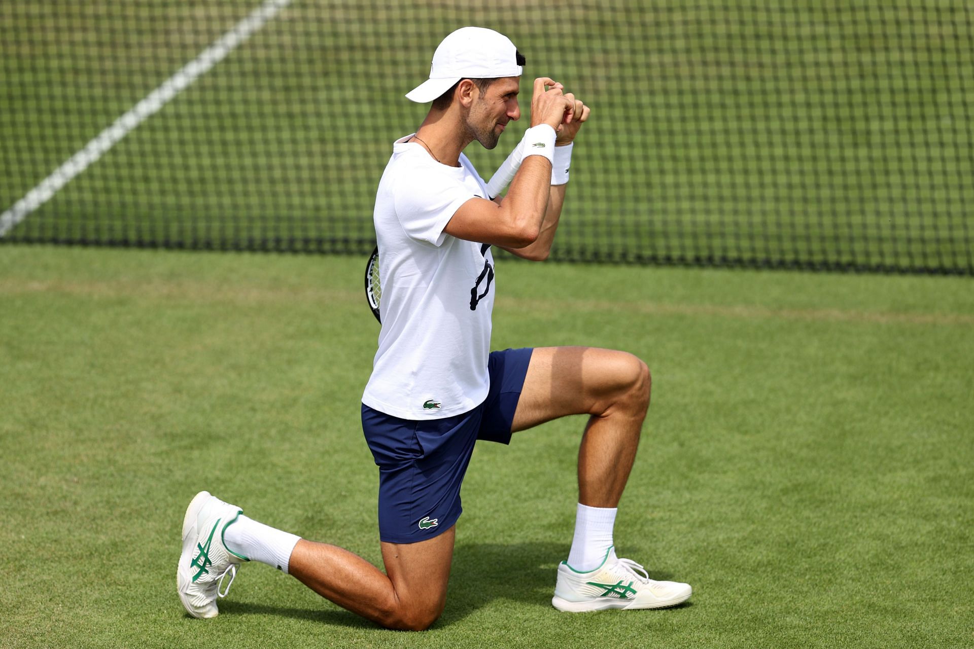 Novak Djokovic gestures during a practice session ahead of his quarterfinal match at the 2022 Championships