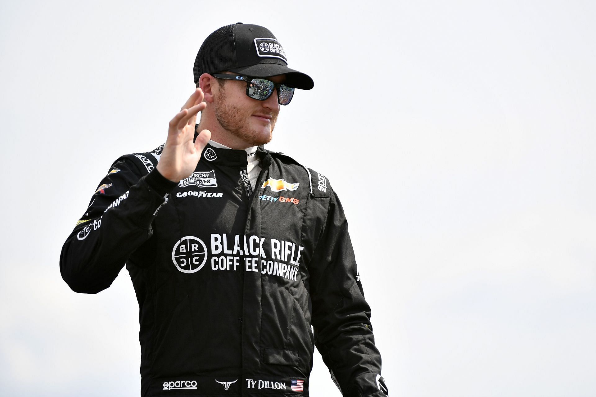 Ty Dillon waves to fans onstage during driver intros before the NASCAR Cup Series Ally 400 at Nashville Superspeedway (Photo by Logan Riely/Getty Images)