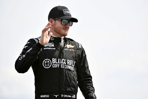 Ty Dillon waves to fans onstage during driver intros before the NASCAR Cup Series Ally 400 at Nashville Superspeedway (Photo by Logan Riely/Getty Images)