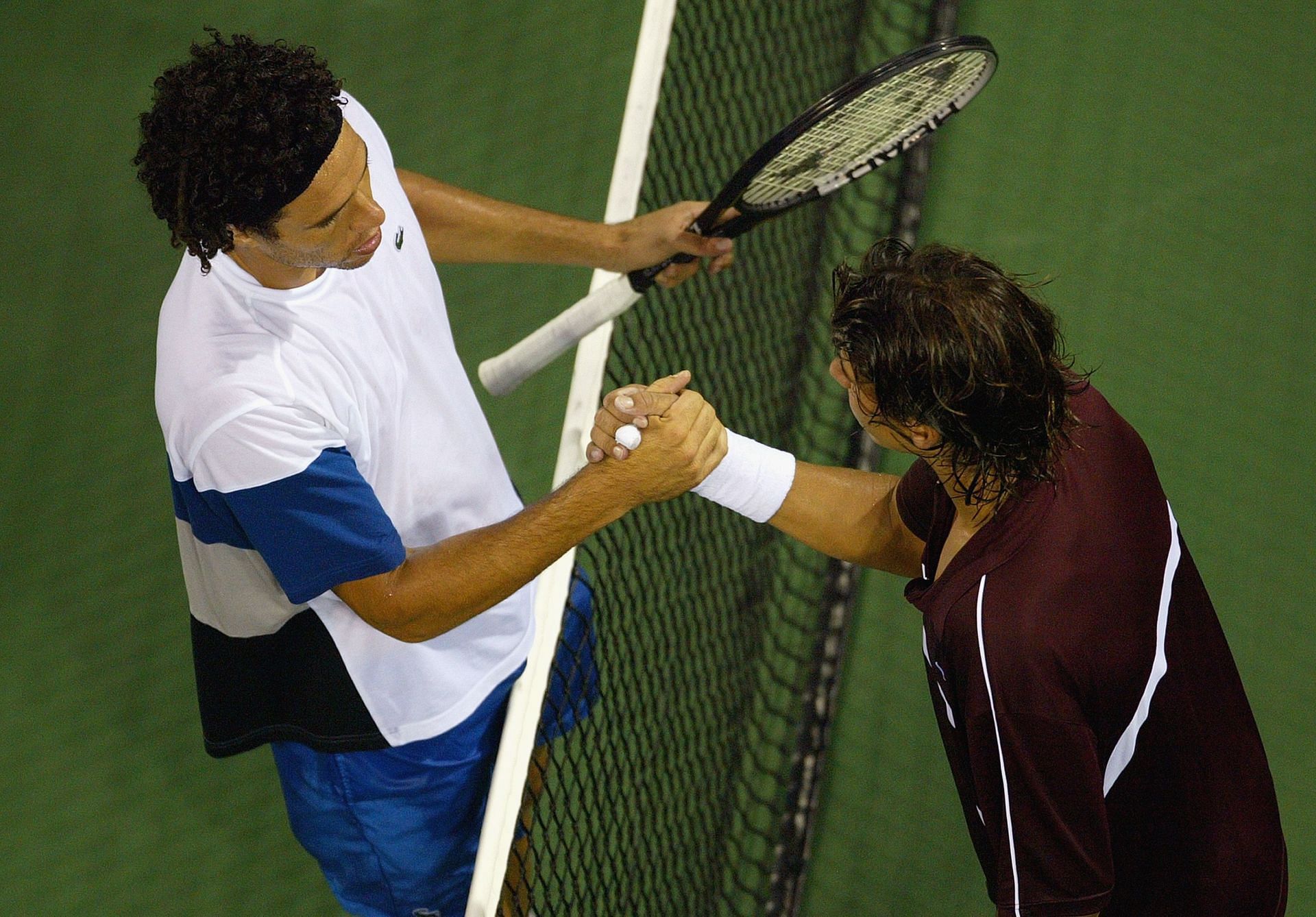 El Aynaoui is congratulated by Rafael Nadal