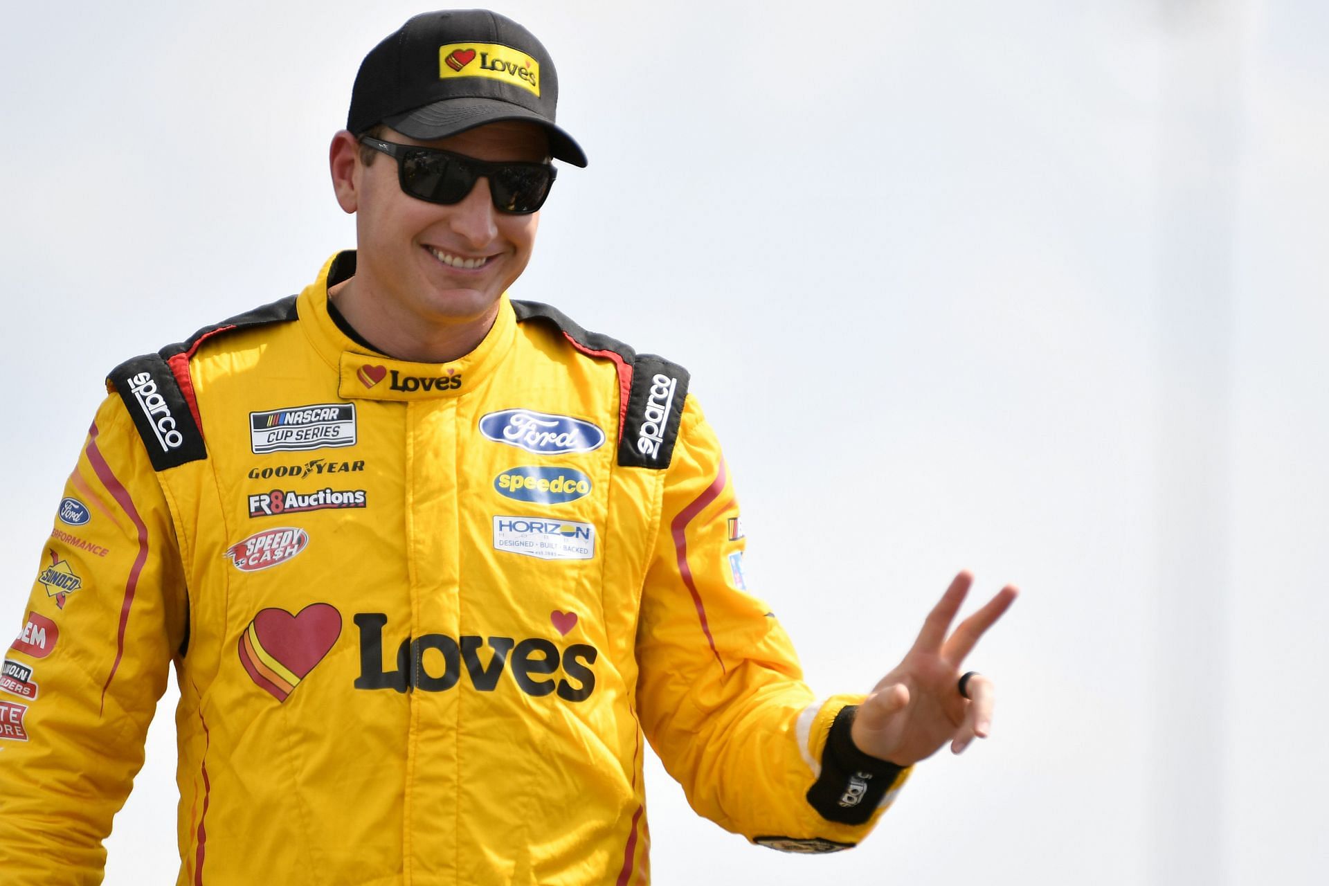 Michael McDowell waves to fans onstage during driver intros prior to the NASCAR Cup Series Ally 400 at Nashville Superspeedway