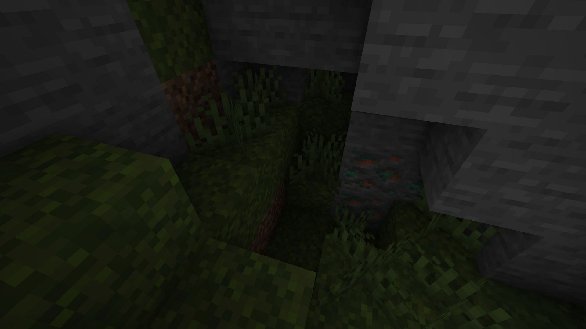 A player spreading moss underground (Image via Minecraft)