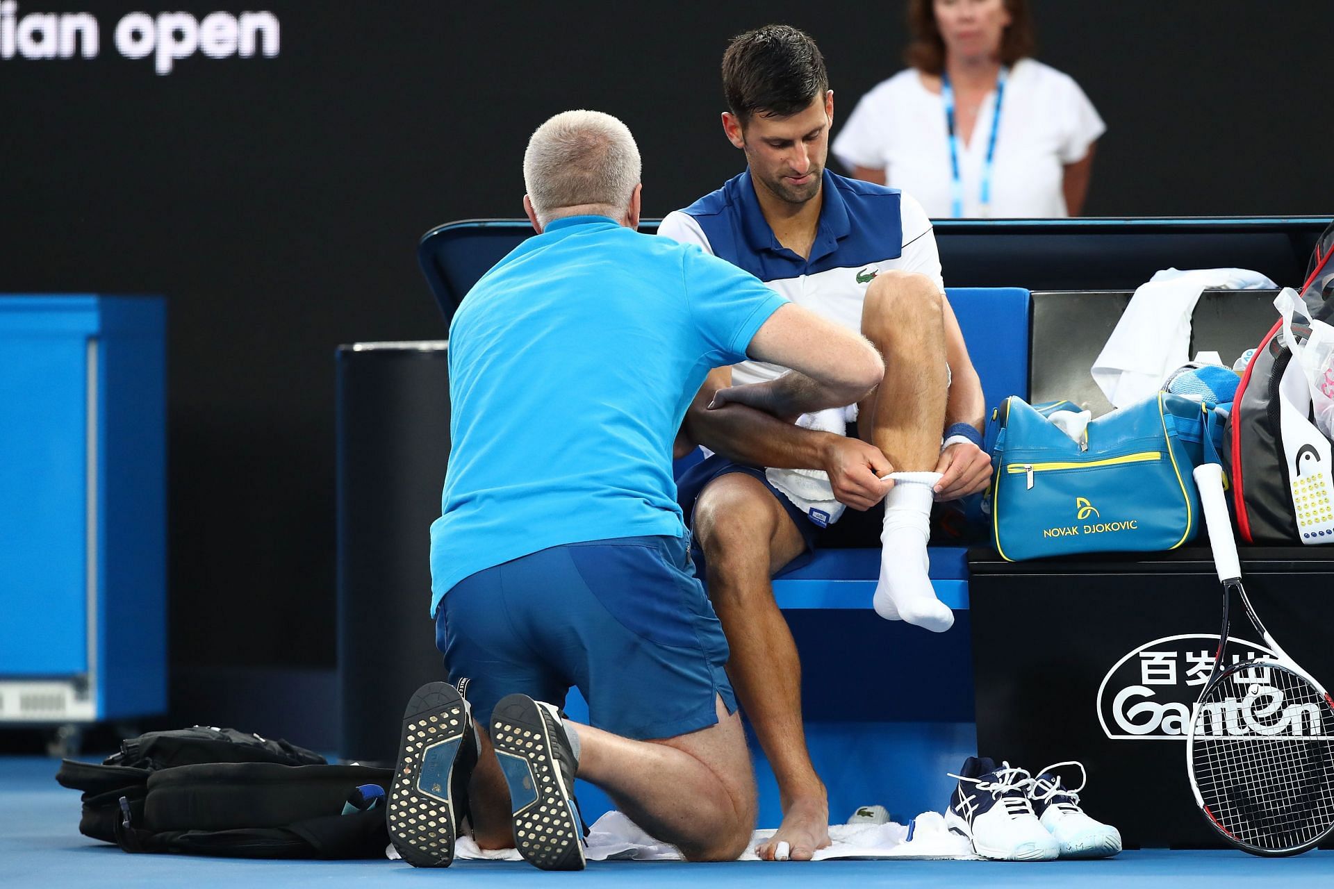 Novak Djokovic receiving medical treatment at the Australian Open. 